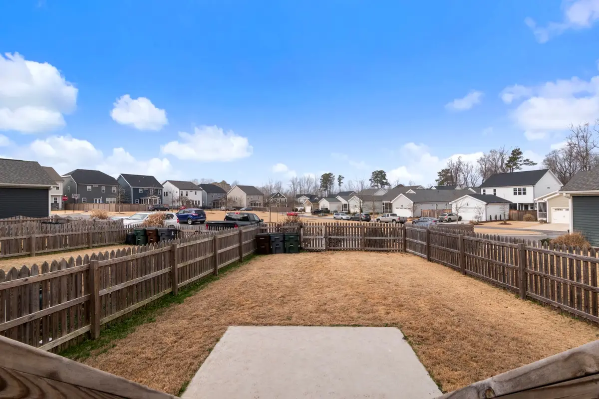 New wooden privacy fence around a suburban backyard